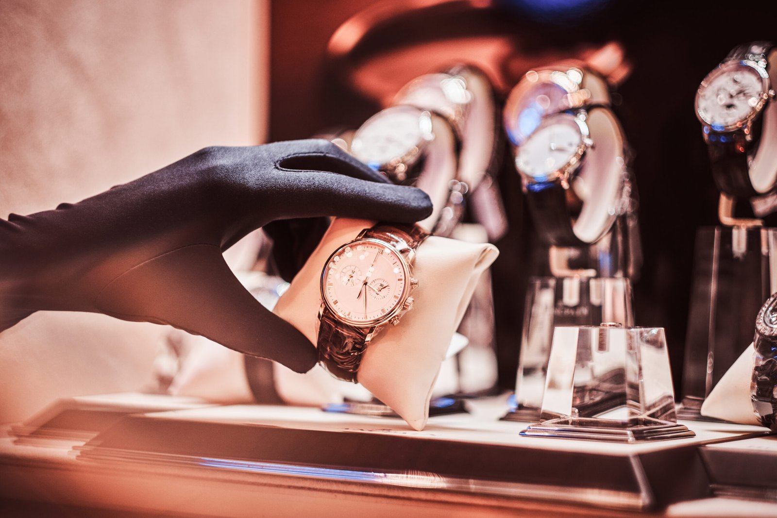 close up of the seller's hand in gloves shows the exclusive men's watch from the new collection